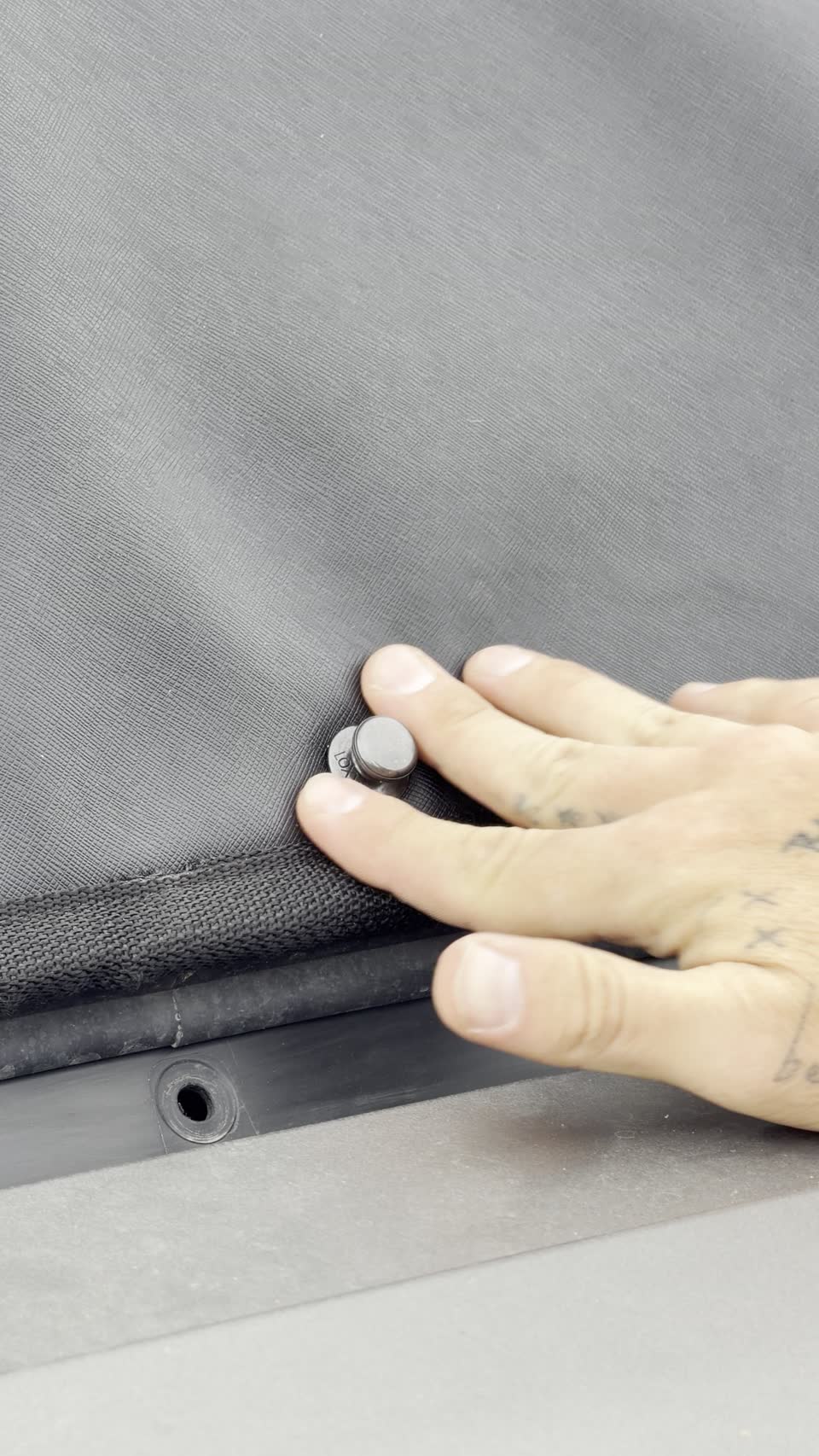 Pressing a LOXX fastener down to lock the cover